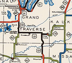 Snippet of July 1, 1938 Michigan State Highway Dept biennial report state trunkline map incorrectly showing US-131 replacing M-113 and continuing along M-42 to a new terminus at US-31 at Chums Corners