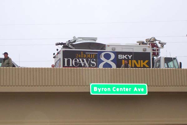 A WOOD-TV 8 "Sky Link" satellite truck arrived on the Byron Center Ave overpass to prepare for live news remotes for the Noon, 5:00, 5:30, 6:00 and 11:00 PM newscasts.