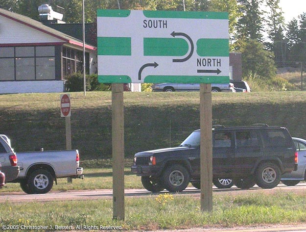 Example of a lesser-used variant on the Michigan Left sign.