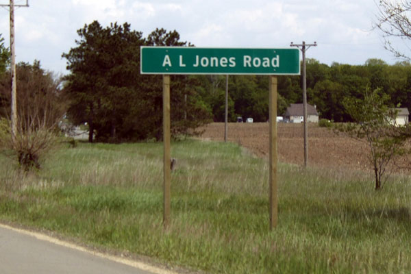 AL Jones Rd sign on M-60