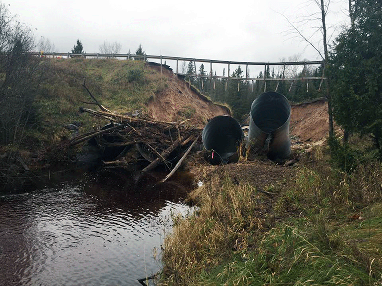 Remains of the twelve-foot culverts formerly channeling the East Branch of the Chocolay River in Marquette County.